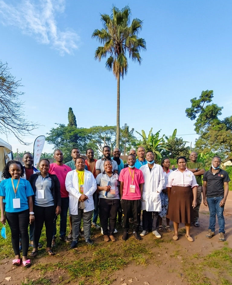 Held at Heart Uganda staff and volunteers together for a team photo outdoors.